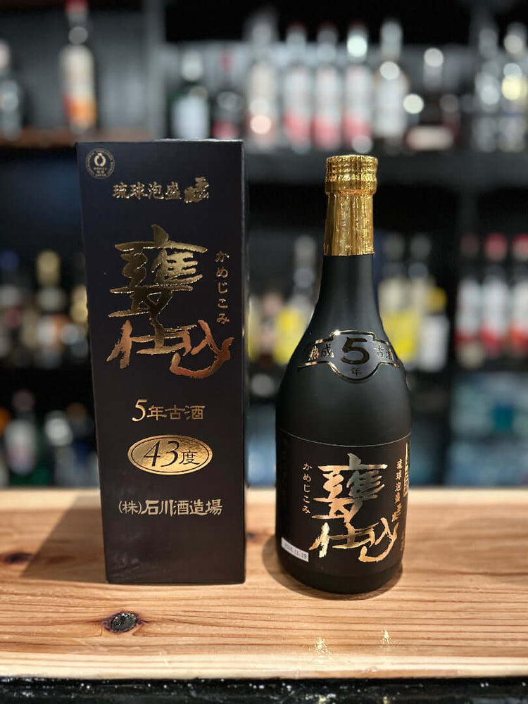 
                  
                    A bottle of Kamejikomi 43% ABV awamori with the box beside it
                  
                